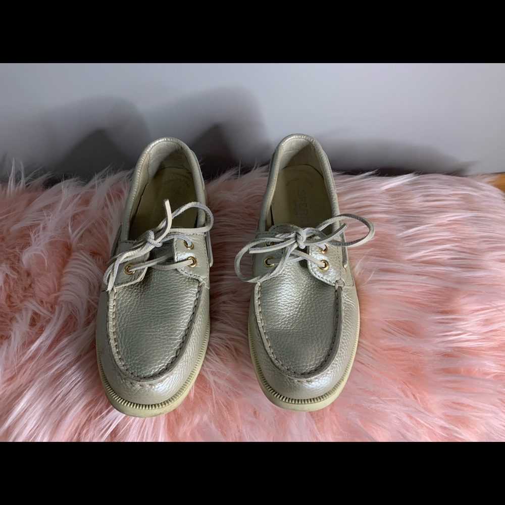 These shoes are a sliver. The brand is Sperry.